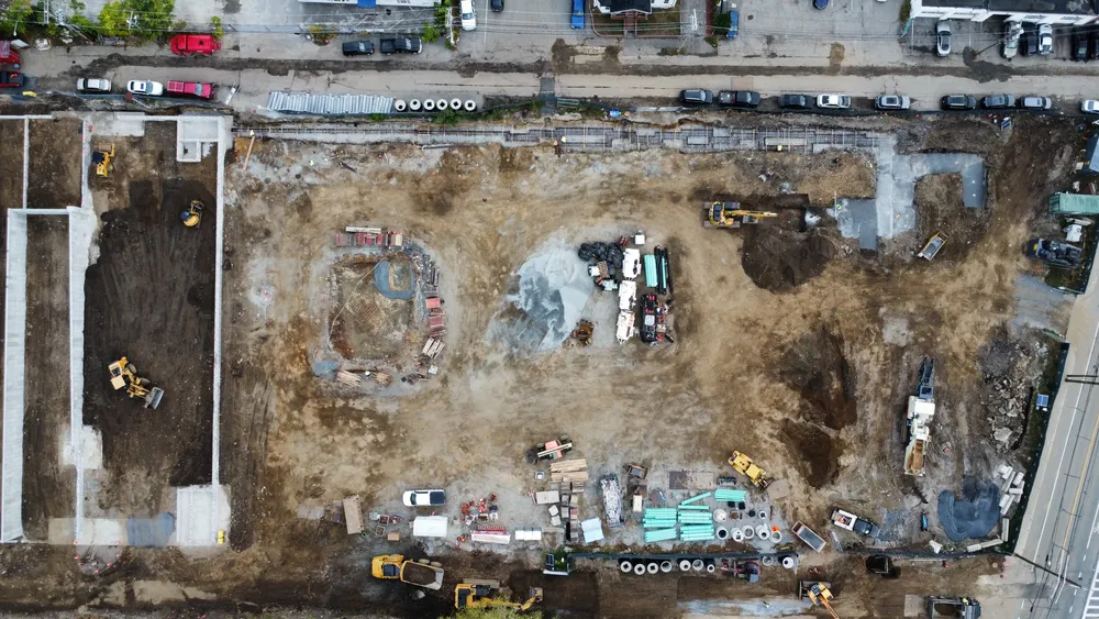Aerial shot of multiple excavators and bulldozers on site